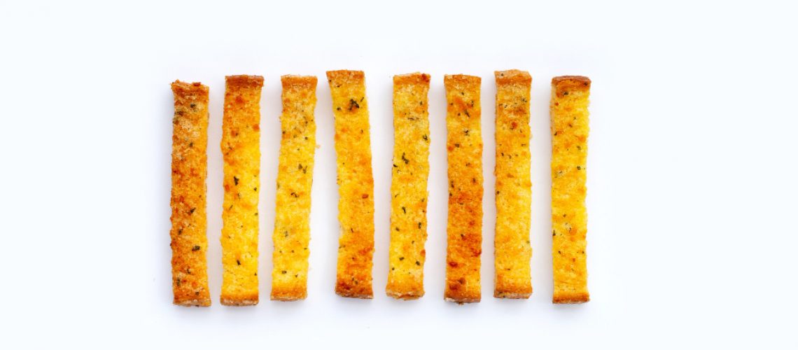 garlic-bread-sticks-isolated-white-surface